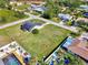 Aerial view of a home with large backyard and solar panels at 7179 Lighthouse St, Englewood, FL 34224