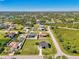 Wide aerial view showing a house and lot in a residential neighborhood at 7179 Lighthouse St, Englewood, FL 34224