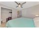 King bedroom with large closet and ceiling fan at 7179 Lighthouse St, Englewood, FL 34224