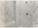 Walk-in shower with marble tile and built-in seat at 7186 Rosemont Dr, Englewood, FL 34224