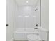 Clean bathroom with a bathtub and marble shower surround at 7329 Mamouth St, Englewood, FL 34224