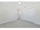 Spacious bedroom with double door closet and gray floors at 7329 Mamouth St, Englewood, FL 34224