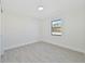 Bright bedroom featuring gray tile floors and large window at 7329 Mamouth St, Englewood, FL 34224