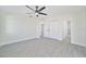 Bright bedroom with ceiling fan and ample closet space at 7329 Mamouth St, Englewood, FL 34224