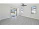 Spacious bedroom with tile floor and sliding glass doors to patio at 7329 Mamouth St, Englewood, FL 34224