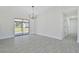 Dining room with sliding doors leading to the backyard at 7329 Mamouth St, Englewood, FL 34224