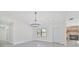 Elegant dining room featuring a chandelier and tile floors at 7329 Mamouth St, Englewood, FL 34224