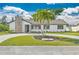 Newly renovated home with a modern exterior and landscaped yard at 7329 Mamouth St, Englewood, FL 34224