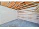 Partially finished storage room with pegboard walls and wooden shelves at 7329 Mamouth St, Englewood, FL 34224