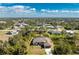 Aerial view of a single-Gathering home with a large backyard and a swimming pool at 7442 Clearwater St, Englewood, FL 34224