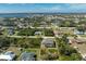 Aerial view of a house with a pool and a large lot in a residential area at 7442 Clearwater St, Englewood, FL 34224