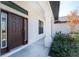 Front door entry with a sidelight and a walkway at 7442 Clearwater St, Englewood, FL 34224