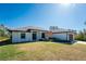 Single-story home with attached garage and well-maintained landscaping at 7442 Clearwater St, Englewood, FL 34224