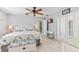 Bright bedroom with a queen-size bed and access to a patio at 7586 Sea Mist Dr, Port Charlotte, FL 33981