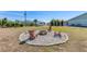 Relaxing firepit area with seating in backyard at 7586 Sea Mist Dr, Port Charlotte, FL 33981