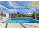 Large screened-in pool with plenty of space for lounging at 7586 Sea Mist Dr, Port Charlotte, FL 33981