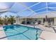 Relaxing pool and patio area with screened enclosure at 7586 Sea Mist Dr, Port Charlotte, FL 33981