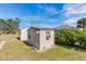 Tan colored storage shed in backyard at 7586 Sea Mist Dr, Port Charlotte, FL 33981