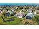 An aerial view of a house with a pool in a residential neighborhood at 8 Sportsman Rd, Rotonda West, FL 33947