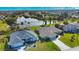 Aerial view of a single-Gathering home with a pool and lake views at 8 Sportsman Rd, Rotonda West, FL 33947