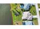 Aerial view showcasing a home's rear and side, near a lake at 8 Sportsman Rd, Rotonda West, FL 33947