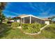 Home exterior showcasing a large screened lanai at 8 Sportsman Rd, Rotonda West, FL 33947