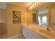 Double vanity bathroom with stained glass window at 8 Sportsman Rd, Rotonda West, FL 33947