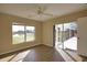 Bedroom with wood-look floors, sliding doors to screened patio, and hot tub at 8 Sportsman Rd, Rotonda West, FL 33947