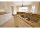 Modern kitchen featuring granite countertops and stainless steel sink at 8 Sportsman Rd, Rotonda West, FL 33947