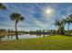 Peaceful waterfront view with lush vegetation at 8 Sportsman Rd, Rotonda West, FL 33947