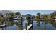 View of a canal with boats and docks, offering waterfront access at 8194 Robert St, Englewood, FL 34224