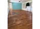 Living room with damaged laminate wood flooring at 8194 Robert St, Englewood, FL 34224