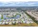 Aerial view of a manufactured home community near a lake at 844 Seabrooke Ct, Englewood, FL 34223