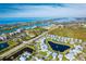 Aerial view of waterfront community, showcasing homes and landscaping at 8768 Conch Ave, Placida, FL 33946