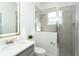 Modern bathroom with shower, vanity, and updated fixtures at 8768 Conch Ave, Placida, FL 33946