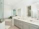 Spa-like bathroom with double vanity and soaking tub at 8768 Conch Ave, Placida, FL 33946