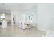 Bright dining room with white table and chairs at 8768 Conch Ave, Placida, FL 33946