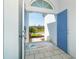 Open double door entryway with a view to a walkway and street at 8768 Conch Ave, Placida, FL 33946