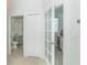 Hallway with access to powder room and pantry at 8768 Conch Ave, Placida, FL 33946