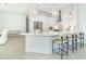 Modern kitchen with white cabinets and island at 8768 Conch Ave, Placida, FL 33946