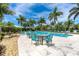 Relaxing pool area with lounge chairs and a table at 8768 Conch Ave, Placida, FL 33946