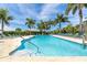 Community swimming pool with plenty of lounge chairs at 8768 Conch Ave, Placida, FL 33946