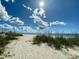 Sandy beach path to the ocean at 9458 Melody Circle, Port Charlotte, FL 33981