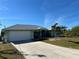 Single story house with attached garage and driveway at 9458 Melody Circle, Port Charlotte, FL 33981