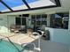 Inviting pool area with covered patio and fire pit at 9458 Melody Circle, Port Charlotte, FL 33981