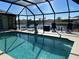 Screened pool and patio overlooking canal at 9458 Melody Circle, Port Charlotte, FL 33981