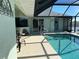 Pool and patio area with canal view at 9458 Melody Circle, Port Charlotte, FL 33981