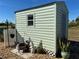 Charming storage shed with garden decor at 9458 Melody Circle, Port Charlotte, FL 33981