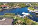 An aerial view of the property featuring a private dock and boat lift at 9676 Singer Cir, Port Charlotte, FL 33981