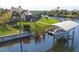 The house has a private dock with a boat lift and screened-in lanai at 9676 Singer Cir, Port Charlotte, FL 33981